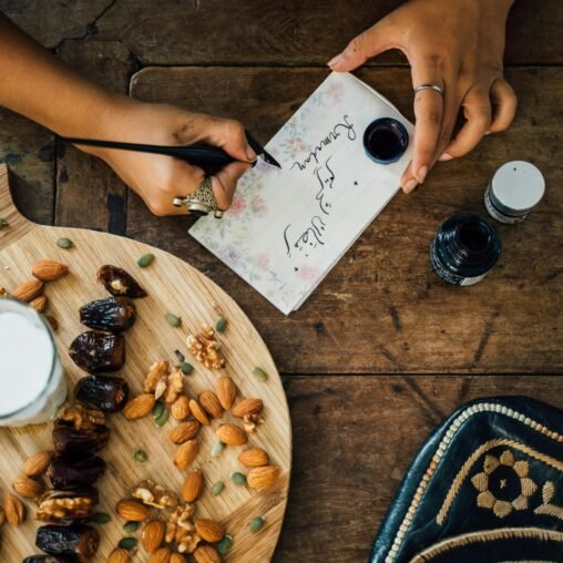 Dates on a platter with a Ramadan Kareem card during Ramadan