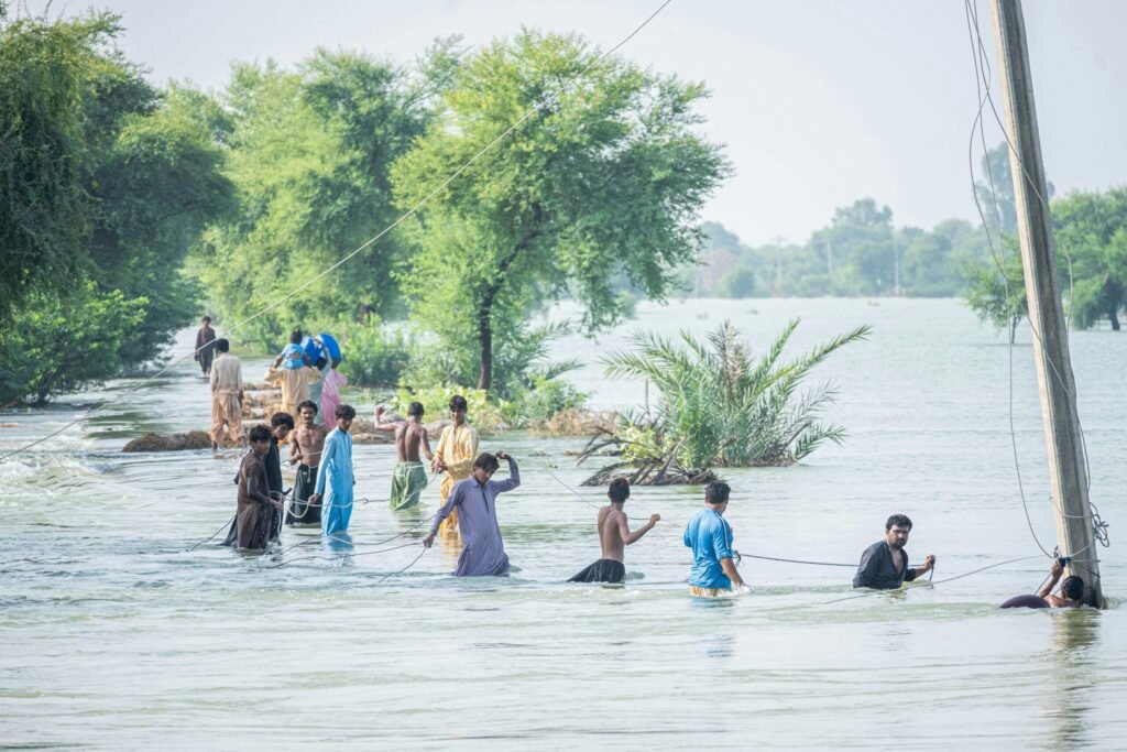 A Group of People Struggling in Flooded Areas, Another Reason of Climate Migration in Pakistan.