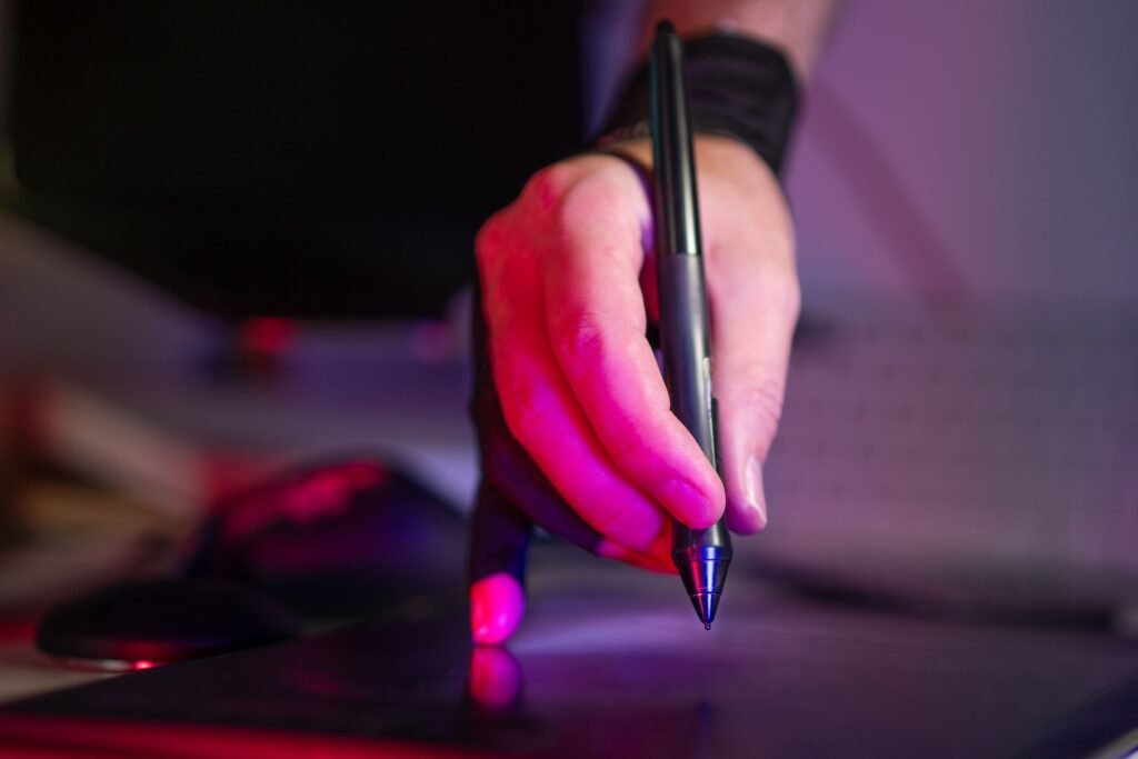 A man's hand holding a pen (skills based careers in Pakistan).